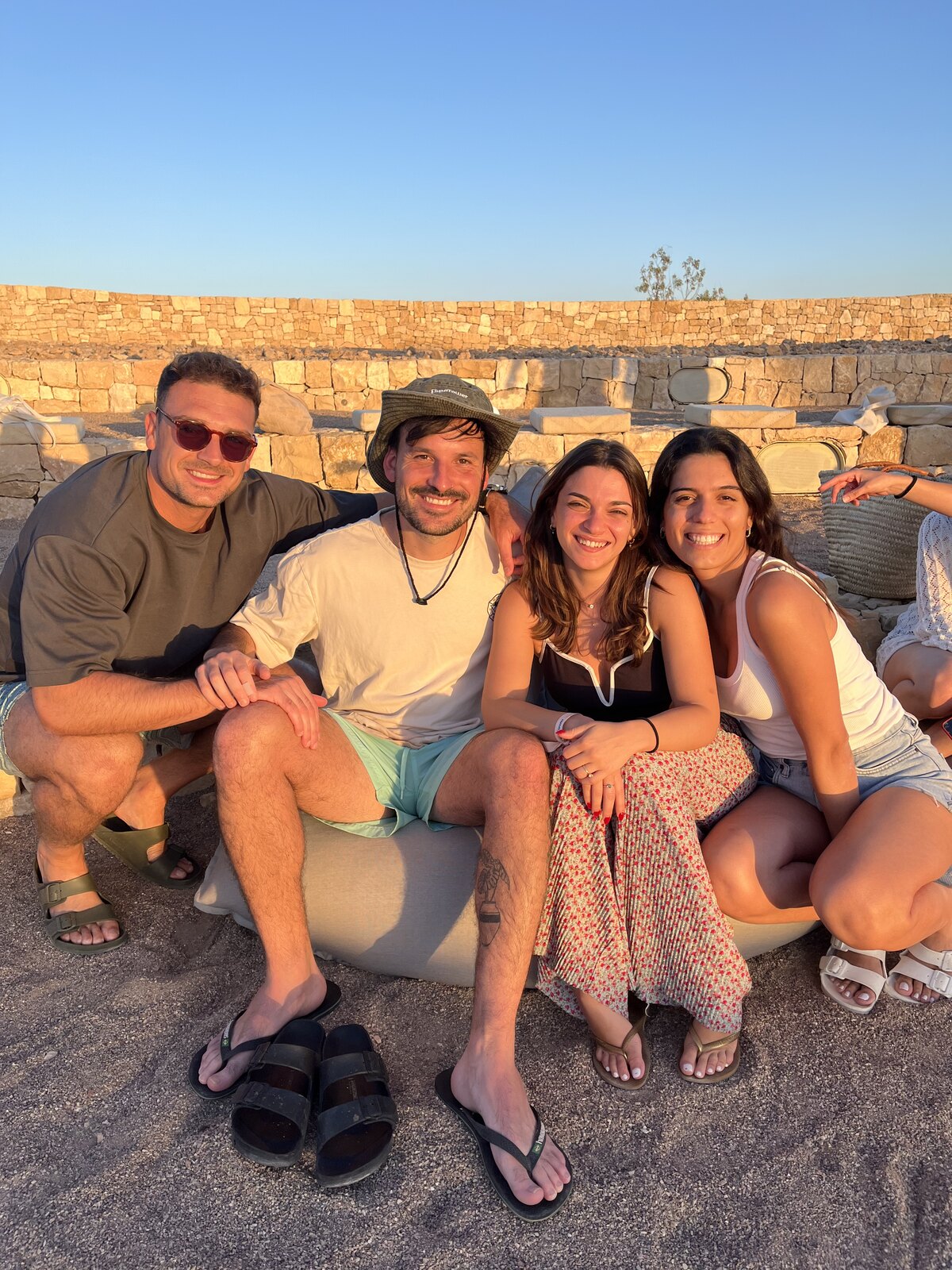 Friends watching sunset at offsite